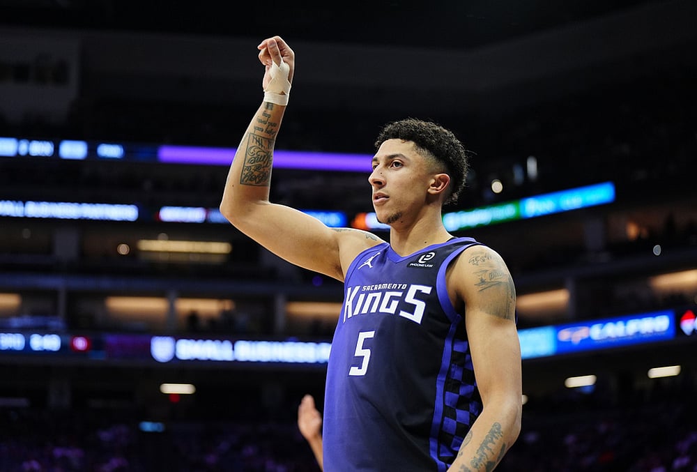 Sacramento Kings guard Nique Clifford (5) reacts after hitting a three-point basket during the second half of an NBA basketball game against the New Orleans Pelicans in Sacramento, California.  - | Photo: AP/Alan Greth