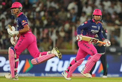Rajasthan Royals' Yashasvi Jaiswal, left, and Vaibhav Sooryavanshi, right, run between the wickets during the Indian Premier League cricket match between Gujarat Titans and Rajasthan Royals in Ahmedabad.