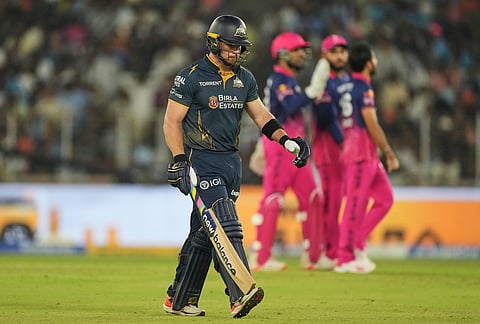 Gujarat Titans' Glenn Phillips leaves the ground after losing his wicket during the Indian Premier League cricket match between Gujarat Titans and Rajasthan Royals in Ahmedabad.