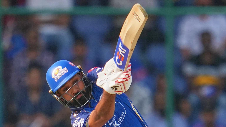 Mumbai Indians' Rohit Sharma plays a shot during the Indian Premier League cricket match between Delhi Capitals and Mumbai Indians in New Delhi, India, Saturday, April. 4, 2026. - (AP Photo/Manish Swarup)