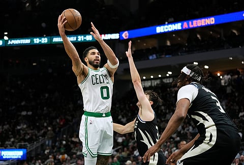 Boston Celtics' Jayson Tatum shoots against Milwaukee Bucks' Cormac Ryan during the second half of an NBA basketball game in Milwaukee.