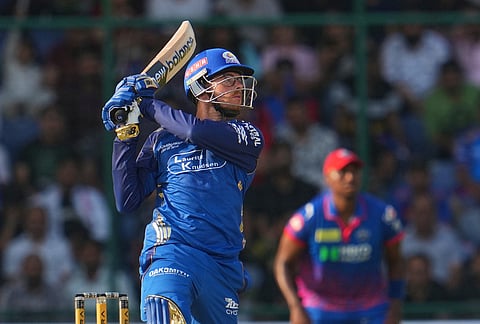 Mumbai Indians' Mitchell Santner plays a shot during the Indian Premier League cricket match between Delhi Capitals and Mumbai Indians in New Delhi.