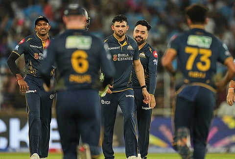 Gujarat Titans' players celebrate the wicket of Rajasthan Royals’ Vaibhav Sooryavanshi during the Indian Premier League cricket match between Gujarat Titans and Rajasthan Royals in Ahmedabad.