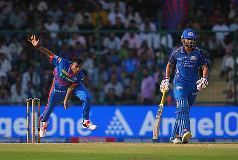 Delhi Capitals' T. Natarajan bowls a delivery during the Indian Premier League cricket match between Delhi Capitals and Mumbai Indians in New Delhi.