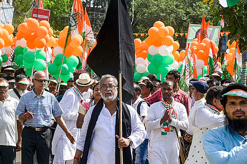 Congress activists during a protest march against the alleged removal of voters' names from electoral rolls during the Special Intensive Revision (SIR) process, in Balurghat, Dakshin Dinajpur district, West Bengal.