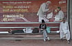 From Ideology To Brand Management: Politics In The Age Of Spectacle by Tribhuvan Tiwari : A Poster displaying Indian Prime Minister Narendra Modi at Bus Stand in New Delhi.
