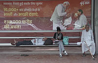 From Ideology To Brand Management: Politics In The Age Of Spectacle by Tribhuvan Tiwari : A Poster displaying Indian Prime Minister Narendra Modi at Bus Stand in New Delhi.