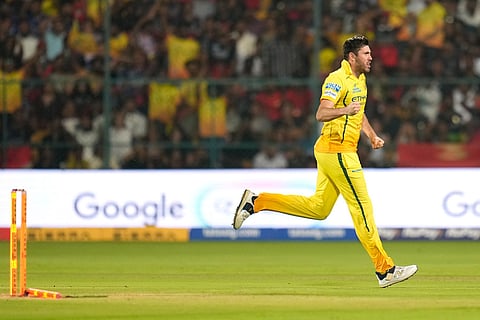 Chennai Super Kings' Jamie Overton celebrates the wicket of Royal Challengers Bengaluru's Devdutt Padikkal during the Indian Premier League cricket match between Chennai Super Kings and Royal Challengers Bengaluru in Bengaluru, India.