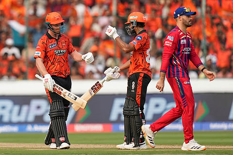 Sunrisers Hyderabad's Heinrich Klaasen, left, celebrates his fifty runs with teammate Nitish Kumar Reddy during the Indian Premier League cricket match between Sunrisers Hyderabad and Lucknow Super Giants in Hyderabad, India.