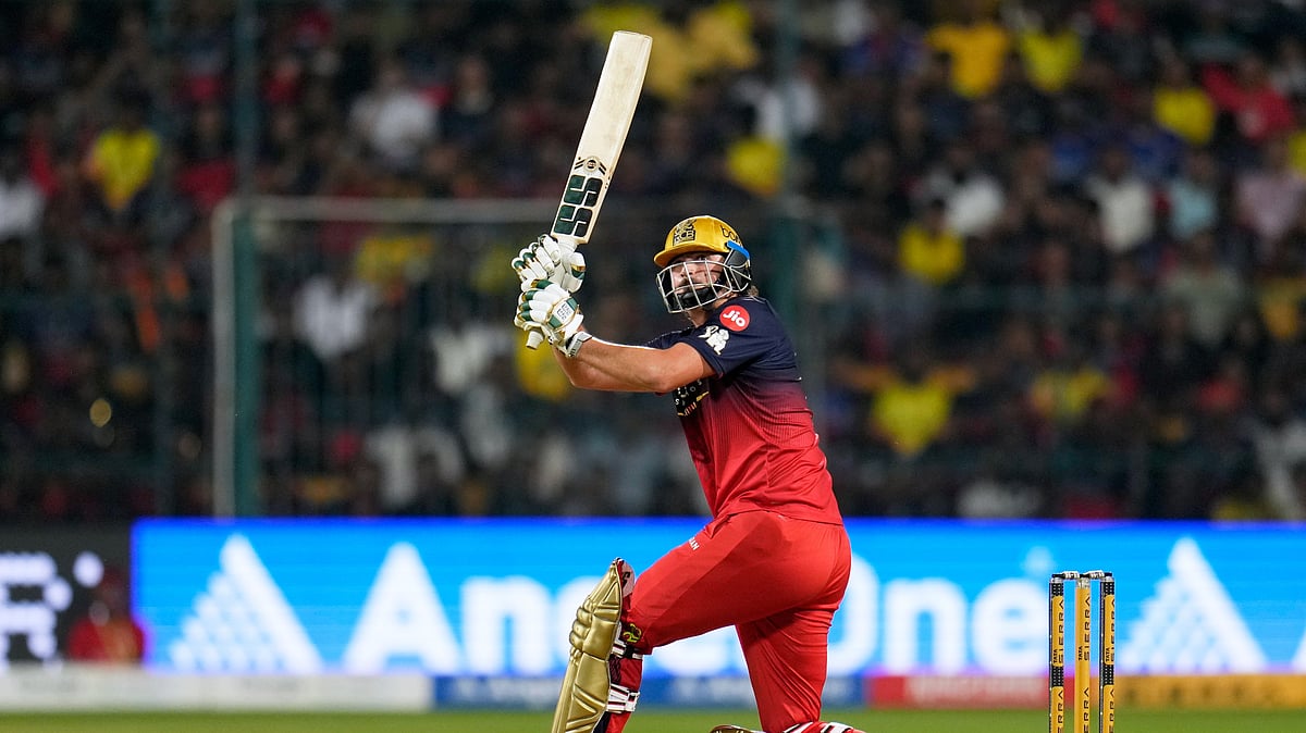 (AP Photo/Aijaz Rahi) : Royal Challengers Bengaluru's Tim David plays a shot during the Indian Premier League cricket match between Chennai Super Kings and Royal Challengers Bengaluru in Bengaluru, India, Sunday, April 5, 2026.