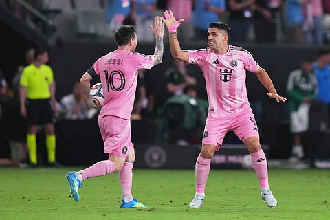 Inter Miami CF forward Luis Suárez, right, celebrates with forward Lionel Messi (10) after scoring a goal during the second half of an MLS soccer match against Austin FC in Miami.