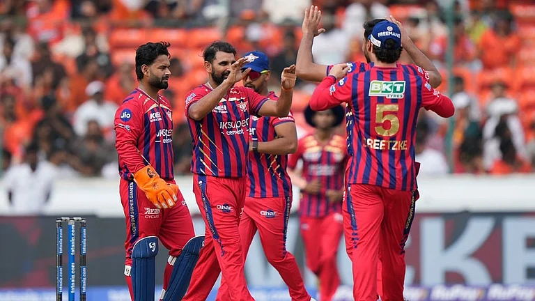 Lucknow Super Giants' Mohammed Shami, centre, celebrates with teammates the wicket of Sunrisers Hyderabad's Travis Head during their Indian Premier League 2026 match in Hyderabad. - AP