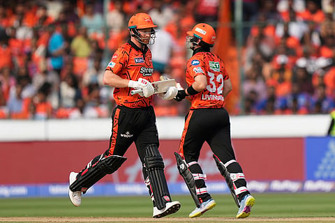 Sunrisers Hyderabad's Heinrich Klaasen, left, and Liam Livingstone run between the wickets during the Indian Premier League cricket match between Sunrisers Hyderabad and Lucknow Super Giants in Hyderabad, India.