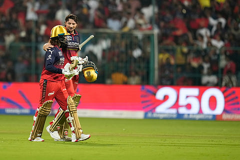 Royal Challengers Bengaluru's captain Rajat Patidar, left, and batting partner Tim David leave the field at the end of their batting during the Indian Premier League cricket match between Chennai Super Kings and Royal Challengers Bengaluru in Bengaluru, India.
