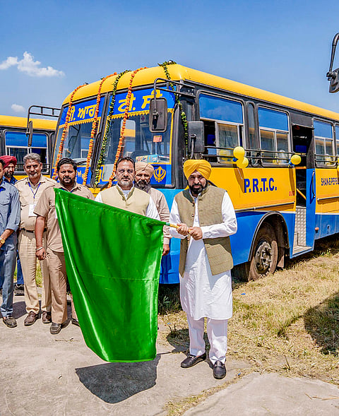 Punjab Chief Minister Bhagwant Mann flags off buses after interacting with PRTC employees, bus conductors and drivers, in Punjab. 