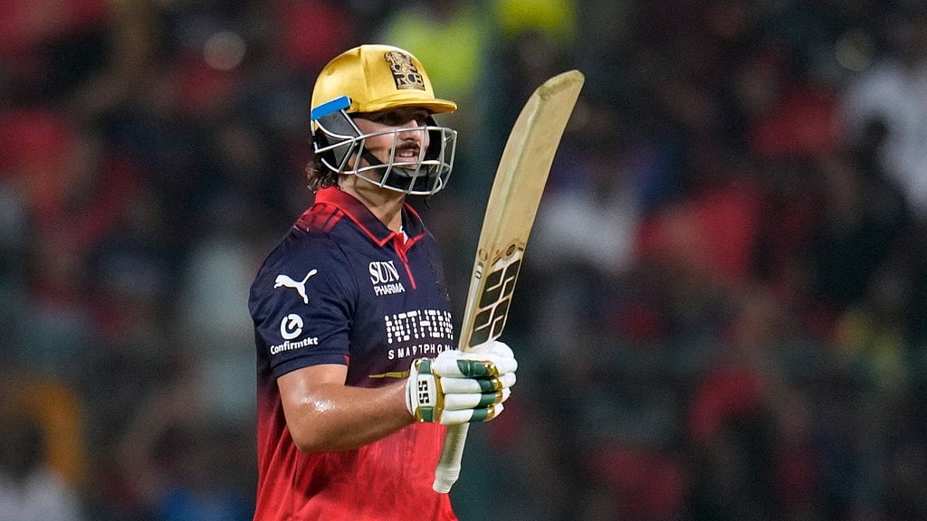 AP Photo/Aijaz Rahi : Royal Challengers Bengaluru's Tim David celebrates his fifty runs during the Indian Premier League cricket match between Chennai Super Kings and Royal Challengers Bengaluru in Bengaluru, India, Sunday, April 5, 2026.
