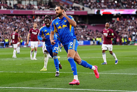 Leeds United's Dominic Calvert-Lewin celebrates scoring their side's second goal from a penalty during the English FA Cup quarterfinal soccer match between West Ham United and Leeds United in London.