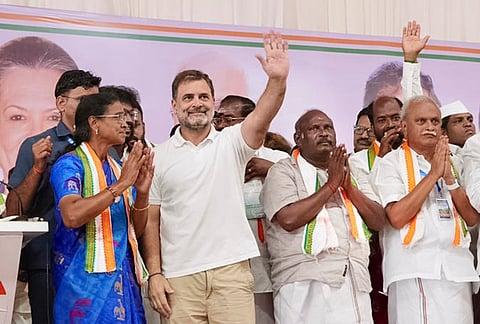 Leader of Opposition in the Lok Sabha and Congress leader Rahul Gandhi waves to the gathering during a public meeting, in Puducherry. 