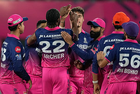 Rajasthan Royals' Nandre Burger celebrates with teammates the wicket of Mumbai Indians' Suryakumar Yadav during the Indian Premier League cricket match between Mumbai Indians and Rajasthan Royals in Guwahati.