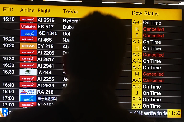 Flights Disrupted Following Strikes On Iran, In New Delhi Passengers look at the screen displaying flight details as several flights are cancelled due to regional airspace closures following escalating tensions and reported military strikes involving Iran, Israel, and the United States in New Delhi, India, on March 1, 2026. - Imago