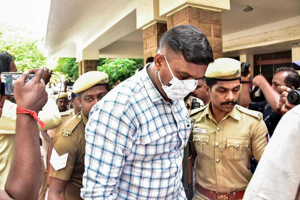 Police escort a convict outside a court premises in connection with the Sathankulam custodial death case, in Madurai, Monday, April 6, 2026. The court sentenced nine Tamil Nadu policemen to death for the 2020 custodial killing of J Benniks and his father P Jayaraj, terming it a rare case.  - PTI