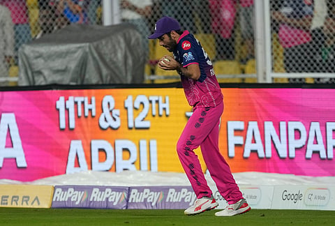 Rajasthan Royals' Ravi Bishnoi takes the catch to dismiss Mumbai Indians' Naman Dhir during the Indian Premier League cricket match between Mumbai Indians and Rajasthan Royals in Guwahati.