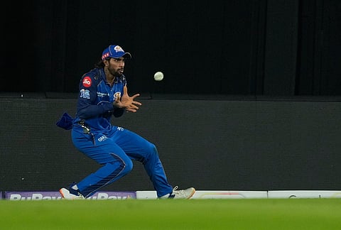 Mumbai Indians' Tilak Verma takes the catch to dismiss Rajasthan Royals' captain Riyan Parag during the Indian Premier League cricket match between Mumbai Indians and Rajasthan Royals in Guwahati.