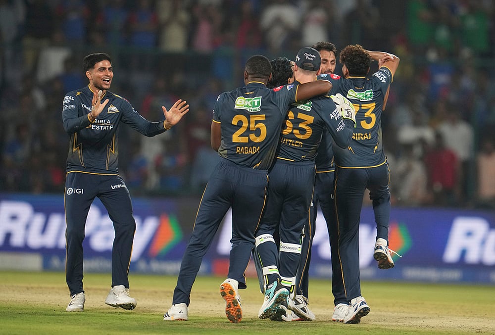 Gujarat Titans' captain Shubman Gill, left, along with his teammates celebrates after they won the Indian Premier League cricket match against Delhi Capitals in New Delhi. - | Photo: AP/Manish Swarup