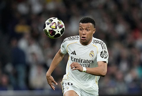Real Madrid's Kylian Mbappe watches the ball during the Champions League quarterfinal first leg soccer match between Real Madrid and Bayern Munich in Madrid, Spain.