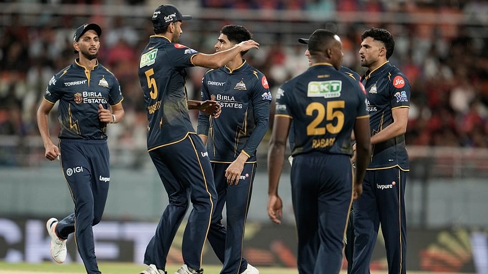 | Photo: AP/Ashwini Bhatia : Gujarat Titans' Ashok Sharma, right, celebrates with teammates the wicket of Punjab Kings' Marco Jansen during the Indian Premier League cricket match between Gujarat Titans and Punjab Kings in New Chandigarh.