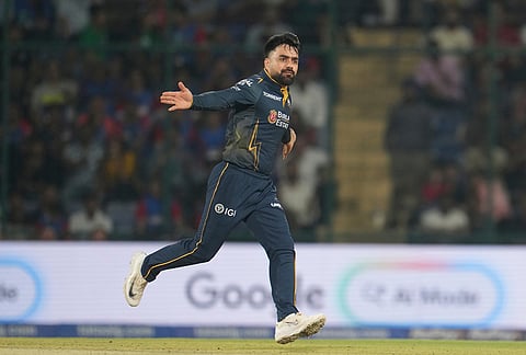 Gujarat Titans' Rashid Khan celebrates the wicket of Delhi Capitals' Nitish Rana during the Indian Premier League cricket match between Delhi Capitals and Gujarat Titans in New Delhi.