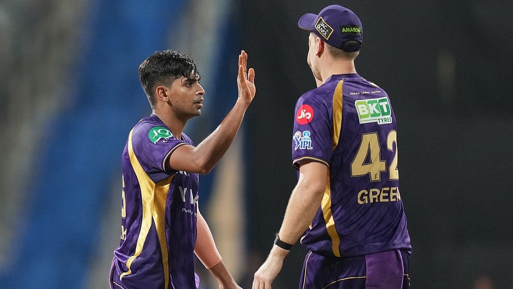 Kolkata Knight Riders' Kartik Tyagi, left, and Cameron Green celebrate the wicket of Mumbai Indians' Suryakumar Yadav during their Indian Premier League match in Mumbai. - AP