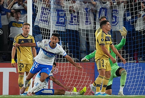 Juan Diaz of Chile's Universidad Catolica celebrates after scoring his side's first goal against Argentina's Boca Juniors during a Copa Libertadores Group D soccer match in Santiago, Chile.