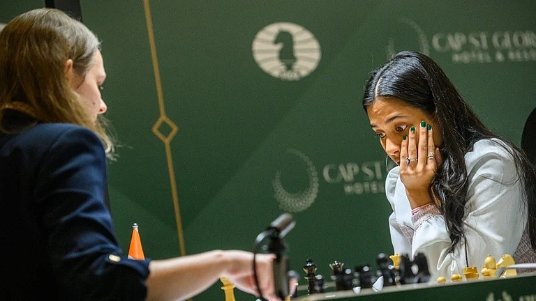 Divya Deshmukh in action against Anna Muzychuk in FIDE Candidates 2026. - FIDE_chess/X