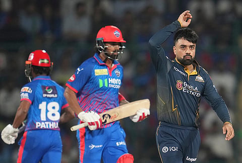 Gujarat Titans' Rashid Khan reacts after delivering a bowl during the Indian Premier League cricket match between Delhi Capitals and Gujarat Titans in New Delhi.