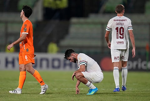 Matheus Martinelli of Brazil's Fluminense, center, reacts at the end of a Copa Libertadores Group C soccer match against Venezuela's Deportivo La Guaira in Caracas, Venezuela.