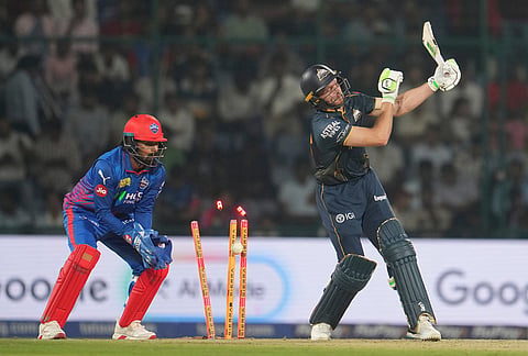 Gujarat Titans' Jos Buttler is bowled out by Delhi Capitals' Kuldeep Yadav during the Indian Premier League cricket match between Delhi Capitals and Gujarat Titans in New Delhi.