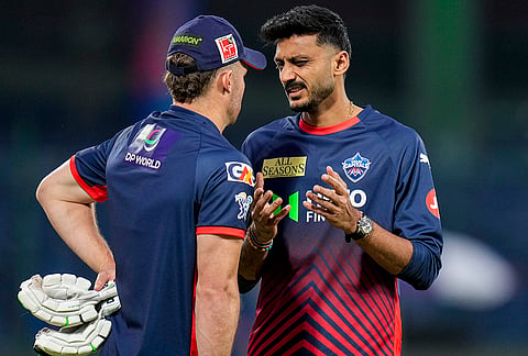 Delhi Capitals' captain Axar Patel, right, during a warm-up session ahead of an Indian Premier League (IPL) 2026 T20 cricket match between Delhi Capitals and Gujarat Titans, at Arun Jaitley Stadium, in New Delhi.