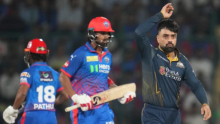 IPL 2026 DC vs GT: Rashid Khan (Right) has swung the game's momentum in his side's favour. - Manish Swarup/AP