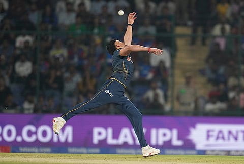 Gujarat Titans' Ashok Sharma try to fields the ball during the Indian Premier League cricket match between Delhi Capitals and Gujarat Titans in New Delhi.