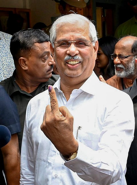 Kerala Governor Rajendra Vishwanath Arlekar shows his ink-marked finger after casting vote during the state Assembly elections, in Thiruvananthapuram. 
