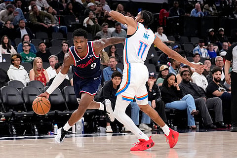 Los Angeles Clippers guard Bennedict Mathurin, left, drives past Oklahoma City Thunder guard Isaiah Joe during the second half of an NBA basketball game in Inglewood, Calif.