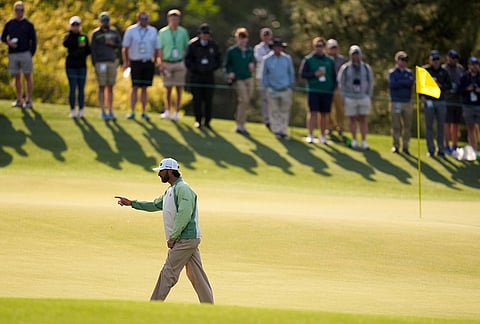 Max Homa walks on the 14th green during a practice round ahead of the Masters golf tournament at the Augusta National Golf Club in Augusta, Georgia.