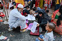 West Bengal Voter List Appeals: Tribunals Clear Just 0.26% Of 25 Lakh Cases Photo: PTI : People wait to submit petitions before the Special Tribunal after their names were deleted from the Special Intensive Revision final voter list ahead of the West Bengal Assembly elections, in Nadia, West Bengal.