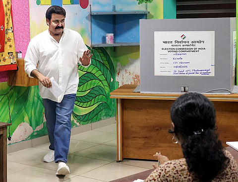 Actor Mohanlal leaves after casting vote during the Kerala Assembly elections, in Thiruvananthapuram.
