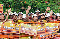 Why The Elite Hate Freebies Photo: IMAGO/ANI News : People holding posters of Lakhpati Didi Scheme posters during a roadshow of Prime Minister Narendra Modi, in Nava Raipur, Chattisgarh