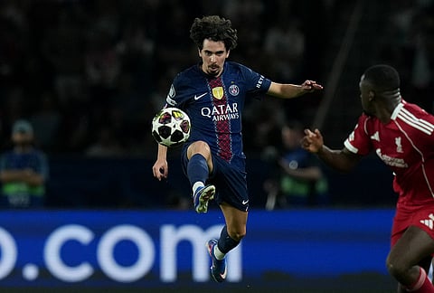 PSG's Vitinha kicks the ball during the Champions League quarterfinal first leg soccer match between Paris Saint-Germain and Liverpool in Paris.