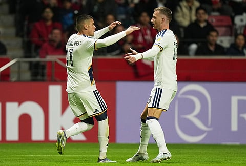 Gabriel Pec, left, celebrates with Marco Reus of the United States' LA Galaxy, after scoring his side's first goal against Mexico's Toluca during a CONCACAF Champions Cup quarterfinal first leg soccer match in Toluca, Mexico.