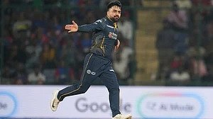 | Photo: AP/Manish Swarup : Gujarat Titans' Rashid Khan celebrates the wicket of Delhi Capitals' Nitish Rana during the Indian Premier League cricket match between Delhi Capitals and Gujarat Titans in New Delhi.