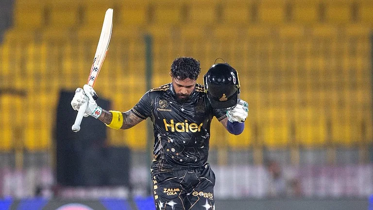 Kusal Mendis celebrating his century against Karachi Kings in PSL 2026 match at National Stadium in Karachi. - thepslt20/X